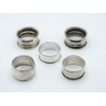 Five various hallmarked silver napkin rings including a pair, weight 66g