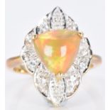 A 9ct gold ring set with a Kalimaya trilliant cut opal surrounded by white sapphires, 5.1g, size M