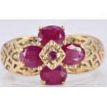 A 9ct gold ring set with rubies with engraved shoulders, 3.5g, size N