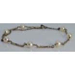 A 9ct white gold bracelet set with pearls