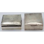 Two hallmarked silver cigarette boxes, one Birmingham 1925 the other Chester 1922, width of wider
