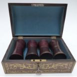 A 19thC brass-bound and inlaid rosewood casket or games box with two pairs of leather dice