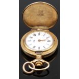 Unnamed 9ct gold pocket watch with gold hands, black Roman numerals, white dial and quartz movement,