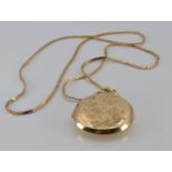 A 9ct gold locket and chain, 13.2g