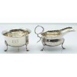 Victorian hallmarked silver sauce boat and sugar bowl, both with wavy edge and raised on three feet,