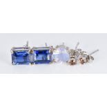 A pair of 9ct white gold earrings set with synthetic sapphires and a pair of 9ct white gold earrings