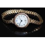 9ct gold ladies wristwatch with subsidiary seconds dial, blued hands, black Arabic numerals, gilt