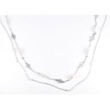 Two early 20thC 9ct white gold necklaces set with seed pearls. length 39cm