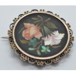 A c1900 Victorian silver brooch set with a pietra dura plaque, diameter 2.5cm