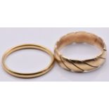 A 9ct gold ring/ band (2.6g, size K) and an 18ct gold wedding band (1.3g, size K)
