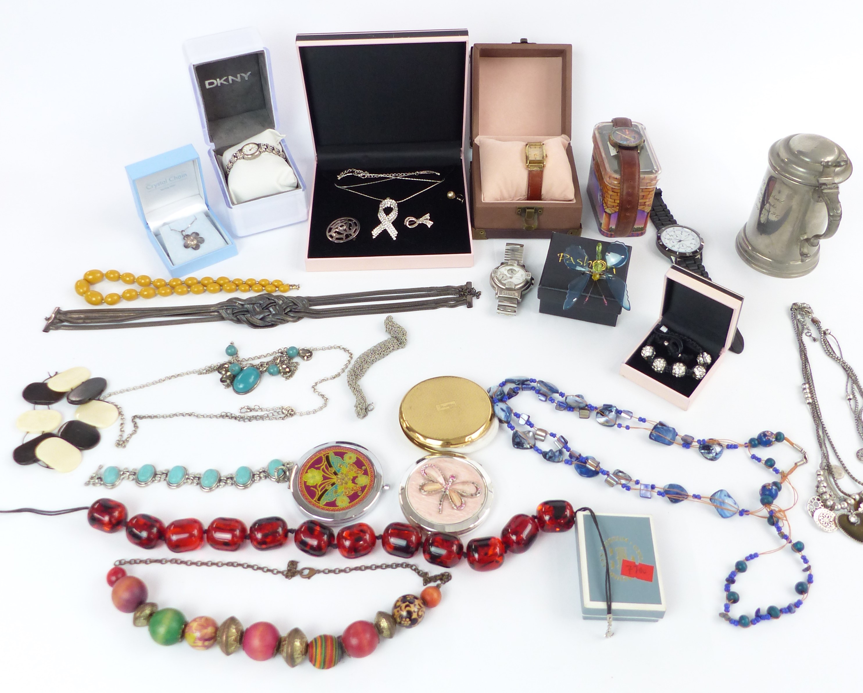 A collection of costume jewellery including beads, brooches etc