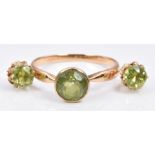 A 9ct gold ring set with a peridot, and similar earrings, 3.1g