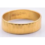 A 22ct gold textured wedding band/ ring, 4.2g, size O/P