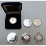 Six various Canada dollars including five silver examples, a 1967 commemorative 80% silver and a
