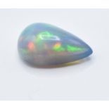 A 3.55ct pear cut black opal cabochon