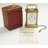Brass corniche cased carriage clock with Roman enamelled dial, in original carry case, H10.5cm