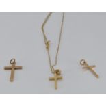 Three 9ct gold crosses and a 9ct gold chain, 3.1g