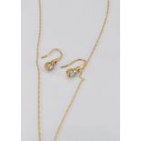 A 9ct gold necklace set with an blue topaz and a diamond and a similar pair of 9ct gold earrings,