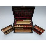 Coromandel cased games compendium, with tooled leather board to lid, chess pieces to front,