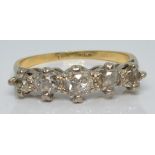 An 18ct gold ring set with five diamonds,  the largest approximately 0.2ct, 2.4g, size I