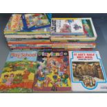 Thirty-two various children's annuals and books including Camberwick Green, Tiswas, Mission