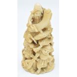 Japanese ivory carving depicting figures all completing different tasks, carved and signed to