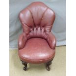 A small faux leather nursing chair and a Victorian mahogany upholstered spoonback chair