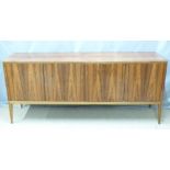 Retro / mid century modern rosewood sideboard with four doors raised on four square tapering legs in