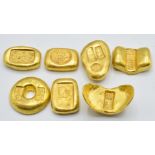 Seven Chinese gold coloured metal trade tokens/ ingots
