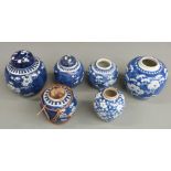 Six Chinese late 19thC/early 20thC blue and white prunus flower porcelain ginger jars, one of