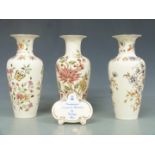 Three Zsolnay Pecs vases and an advertising plaque, tallest 27cm