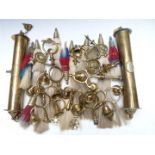 A collection of heavy horse brass finials, bells and plumes including 19thC examples