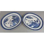 A pair of 19thC Chinese oval chargers decorated with the willow pattern, 38 x 45cm