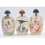 Three Chinese glass reverse painted scent bottles with quartz and lapis lazuli stoppers, 9cm