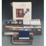 A quantity of GB presentation packs, first day covers and coin / stamp covers
