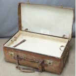 A vintage leather steamer trunk with lift out tray by H J Cave and Son, sole makers of the "Osilite"