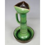 Christopher Dresser style pottery chamberstick with green glaze, possibly Linthorpe, H24cm