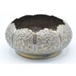 Indian or Burmese white metal bowl with embossed foliate decoration, marked to base T85, diameter