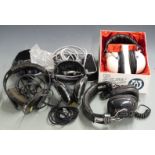 A collection of vintage headphones including Ross RE-270, Micro Diamond SK8005, Revox RH31, boxed