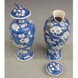 Two 19thC Chinese prunus vases with character marks to base, H23cm