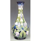 Moorcroft Prestige pedestal vase decorated in the Wolfsbane pattern, designed and signed by Angie