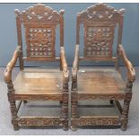 Pair of 19th/20thC carved elm seated Chinese armchairs decorated with auspicious symbols, horned