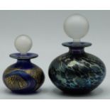 Two Isle of Wight iridescent glass scent bottles with stoppers, largest 9.5cm tall.