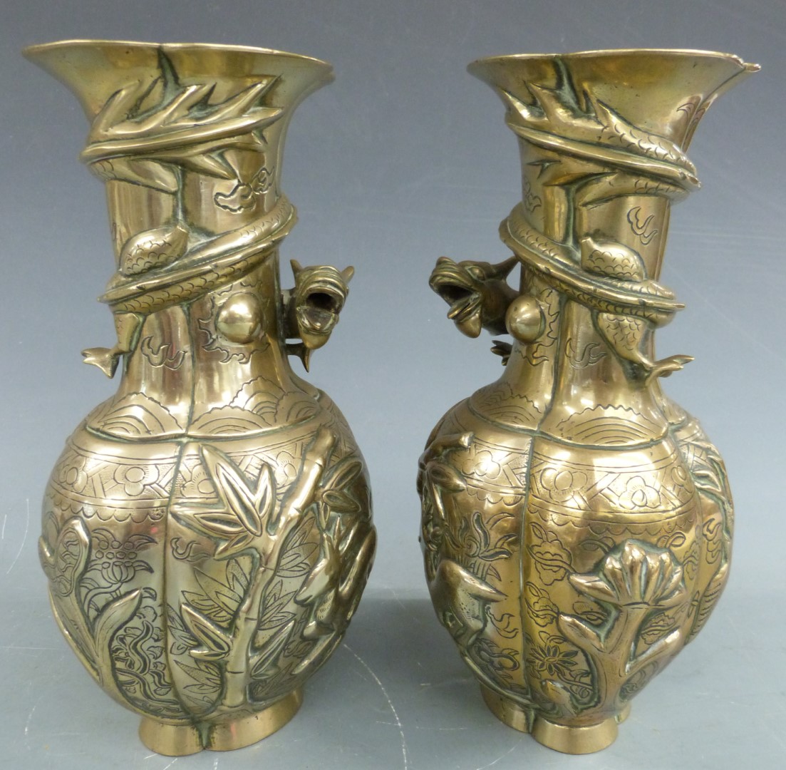 A pair of Chinese bronze / brass vases with dragon decoration, H25cm