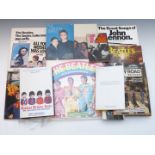 A collection of Beatles books including paperbacks from the 1960's and The Summer of 1968 (numbered)