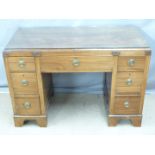Late 19th/20thC mahogany twin pedestal desk raised on bracket feet and with a protective glass