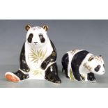 Two Royal Crown Derby paperweights, Giant Panda and Baby Panda Walking, both boxed, tallest 13.5cm