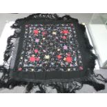 19th/20thC Chinese black shawl with embroidered chrysanthemum decoration and fringe border,