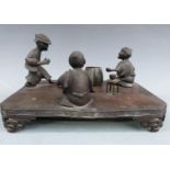 Chinese bronze tableau of three figures, probably playing dice, an unrelated tortoise and vessel,