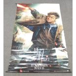 Three large cinema film posters comprising Harry Potter 7 part 2, James Bond Quantam of Solace and